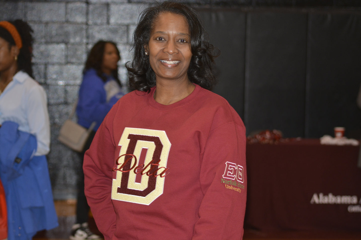 Textured chenille D patch on Delta Sigma Theta crimson crewneck sweatshirt