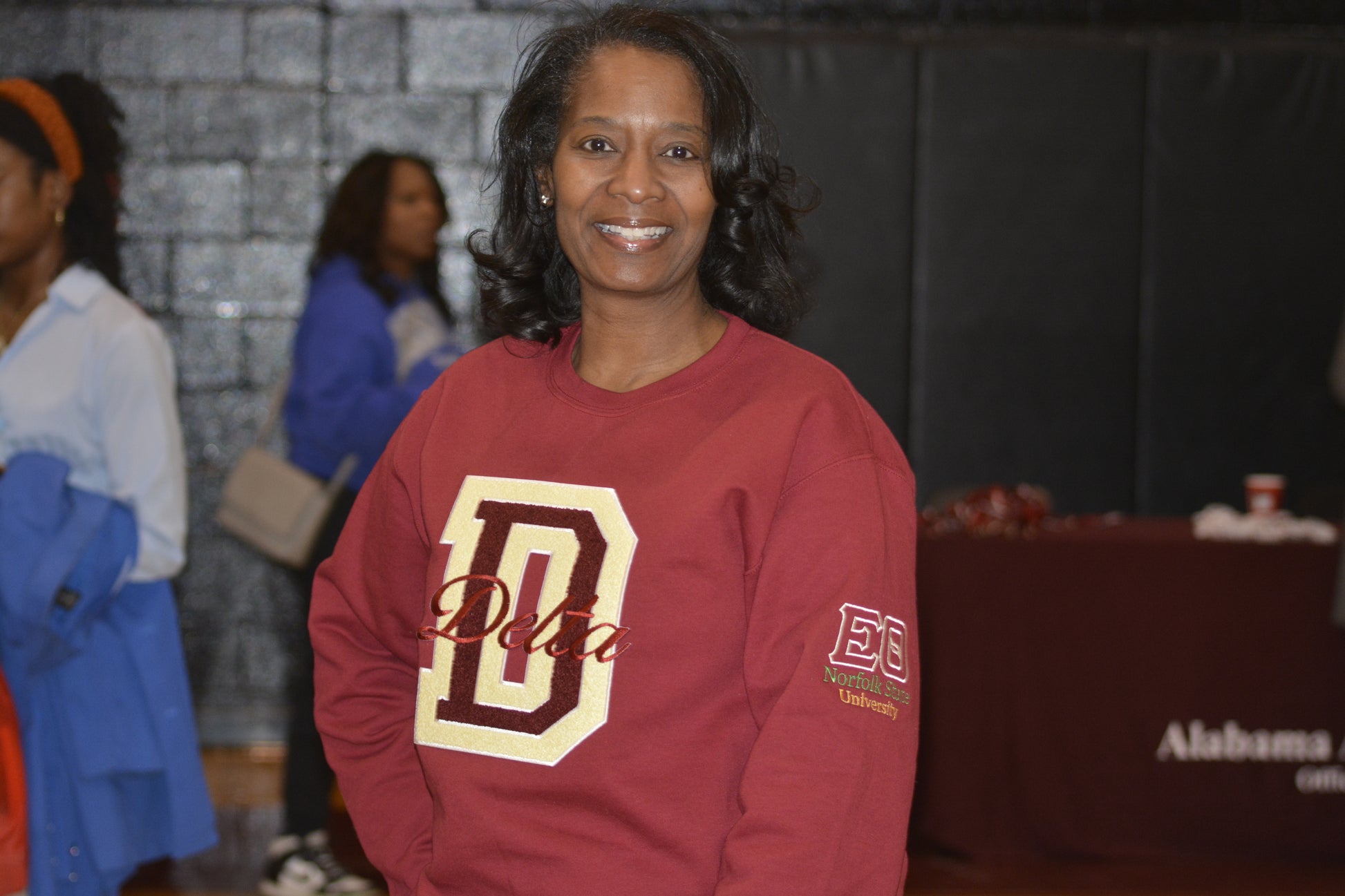 Textured chenille D patch on Delta Sigma Theta crimson crewneck sweatshirt