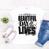 A Beautiful Day To Save Lives slogan tee displayed flat with clear typography